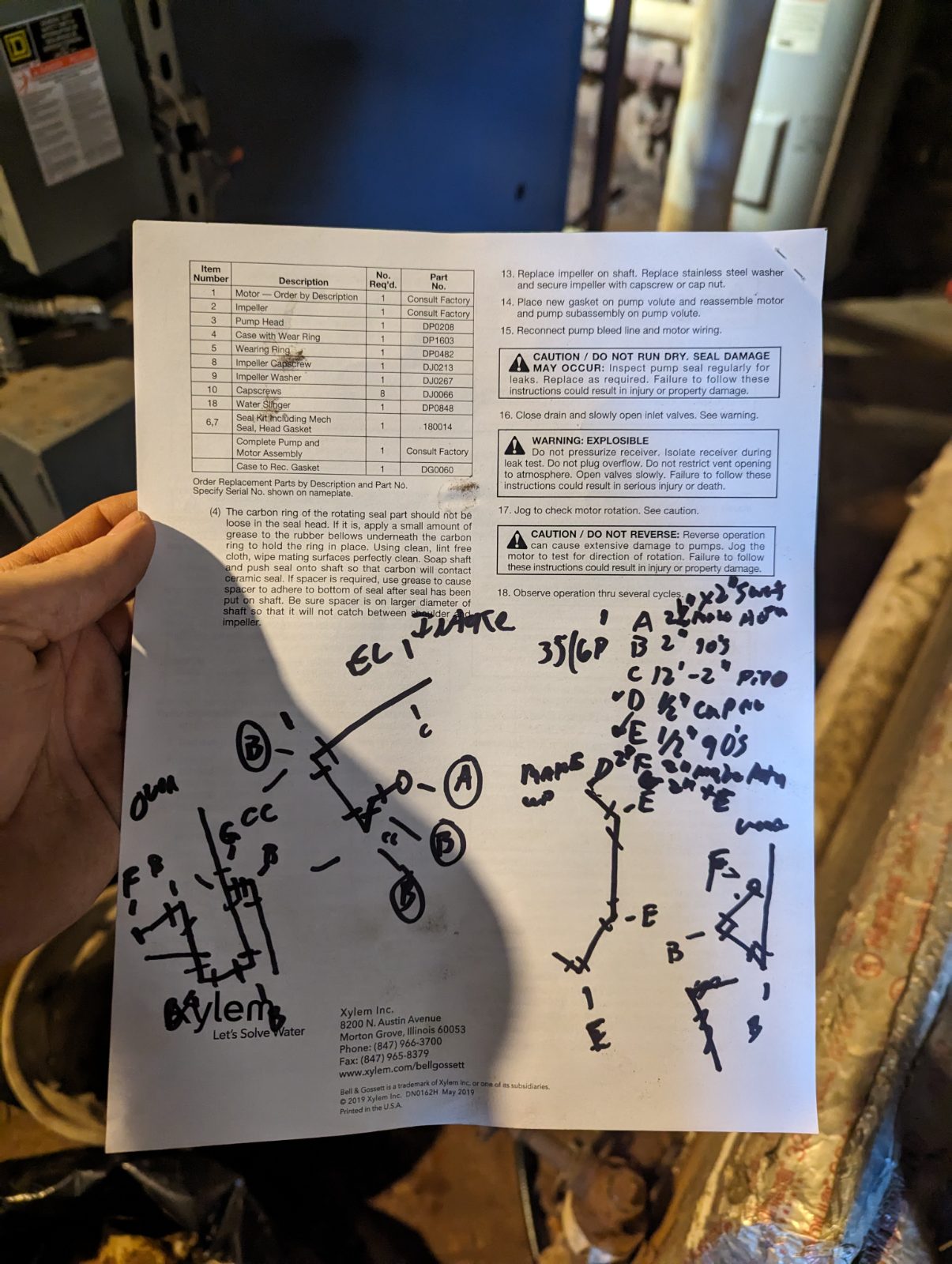 Hand-drawn pipe takeoff on the back of a pump manual
